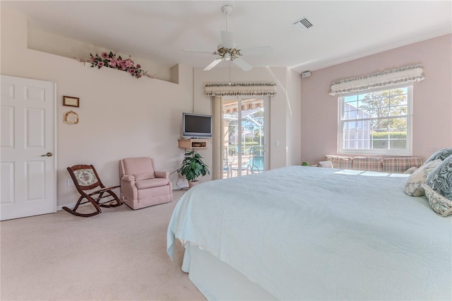 bedroom featuring ceiling fan, light carpet, and access to outside