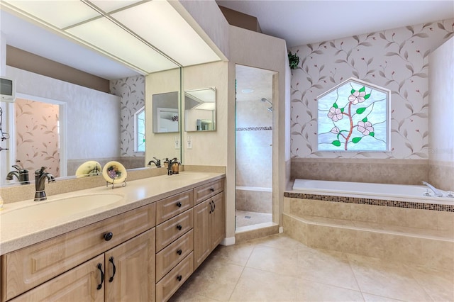 bathroom with vanity, plus walk in shower, a wealth of natural light, and tile patterned flooring