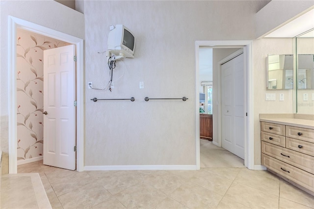 bathroom with vanity and tile patterned flooring