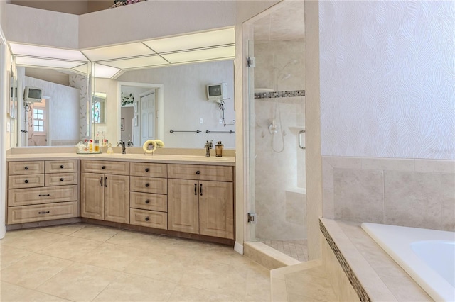 bathroom with vanity, tile patterned floors, and shower with separate bathtub