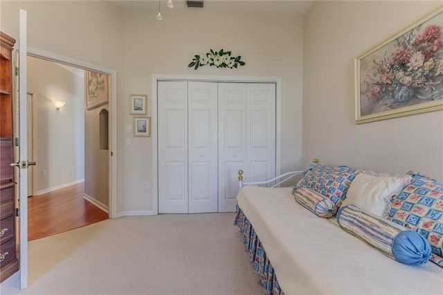 carpeted bedroom featuring a closet