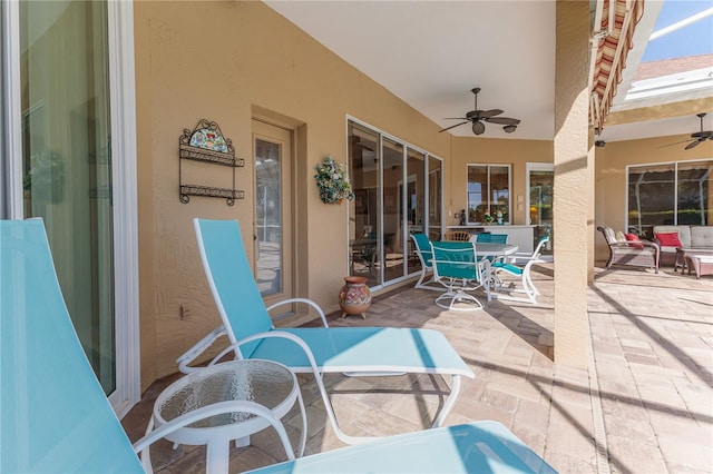 view of patio with ceiling fan