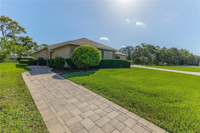 view of home's exterior with a lawn