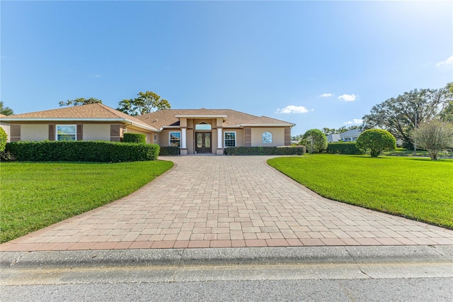 single story home with a front yard