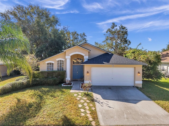 view of front of home featuring a front lawn and a garage