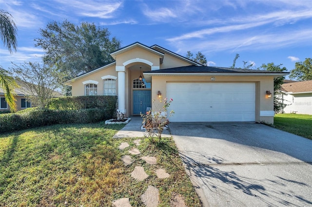 ranch-style house with a front yard and a garage