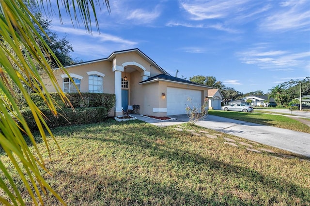 ranch-style home featuring a front lawn and a garage