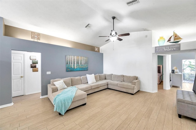 living room with light hardwood / wood-style floors and ceiling fan