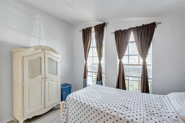 bedroom with light wood-type flooring