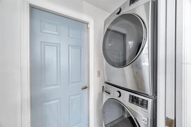 laundry room with stacked washer and clothes dryer