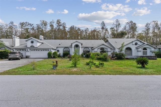 ranch-style house with a front yard and a garage