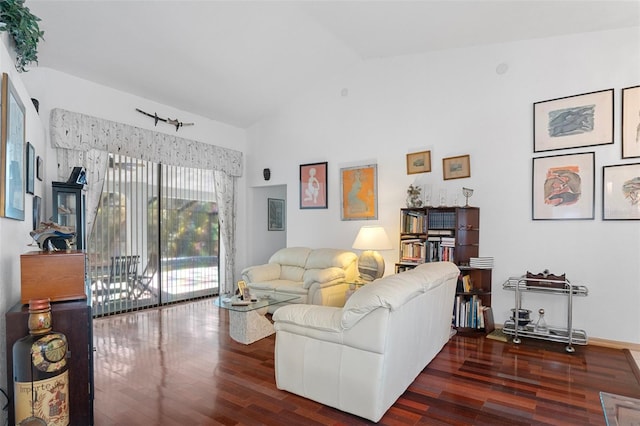 living room featuring vaulted ceiling and dark hardwood / wood-style floors