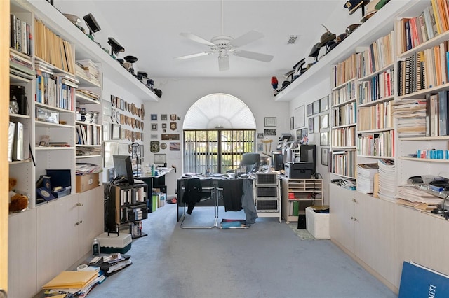 office with concrete floors and ceiling fan