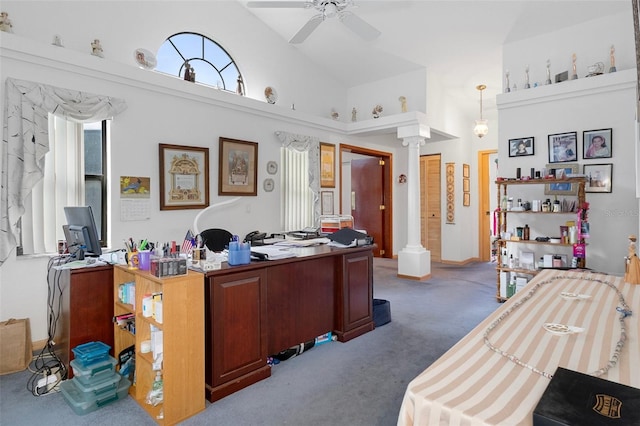 carpeted office featuring ornate columns, high vaulted ceiling, and ceiling fan