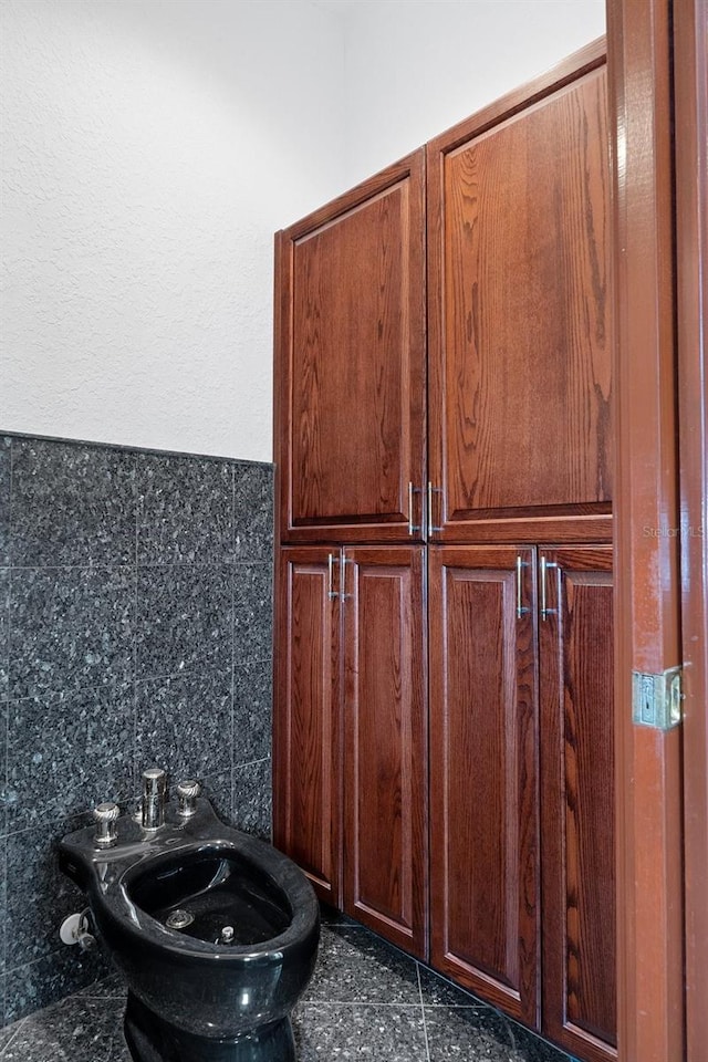 room details featuring tile patterned floors and backsplash