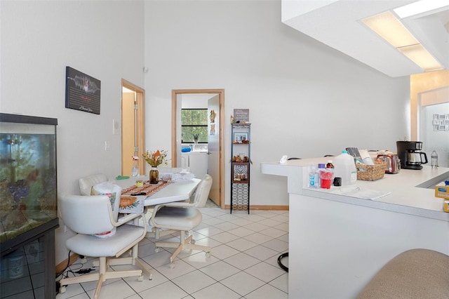 interior space featuring washer / dryer and light tile patterned floors