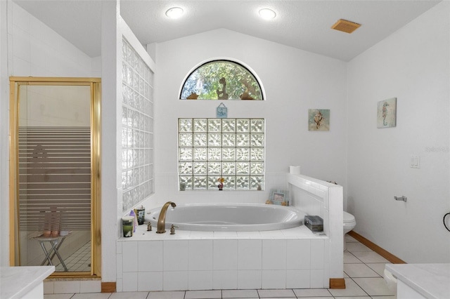 full bathroom with lofted ceiling, toilet, tile patterned flooring, separate shower and tub, and vanity