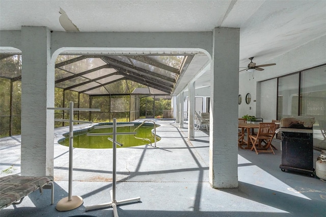 exterior space featuring ceiling fan, a lanai, grilling area, and a patio area