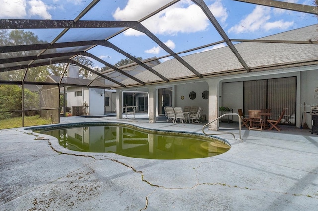 view of pool featuring a patio area and a lanai