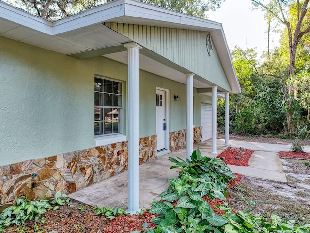 doorway to property featuring a patio