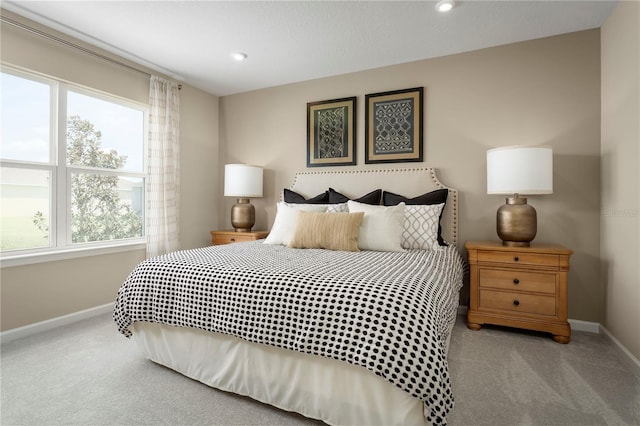 bedroom featuring light colored carpet