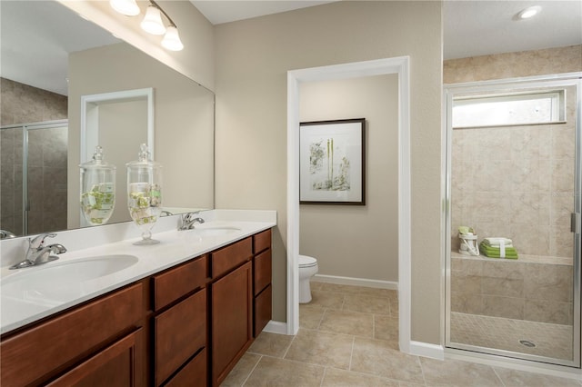 bathroom with vanity, toilet, walk in shower, and tile patterned flooring