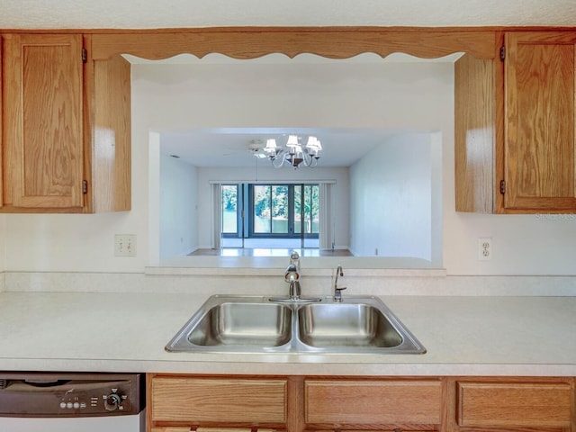 kitchen featuring sink, dishwasher, and a chandelier