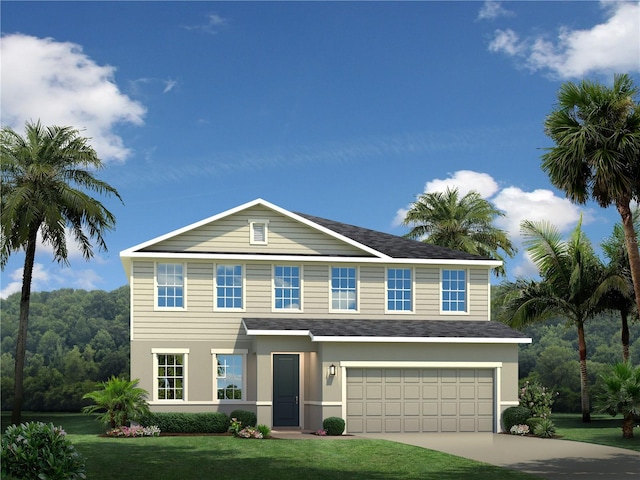 view of front of property with a front yard and a garage