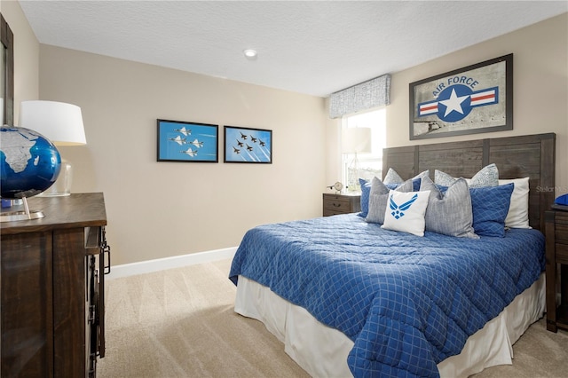 carpeted bedroom with a textured ceiling