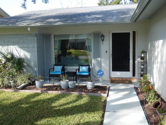 entrance to property with a yard