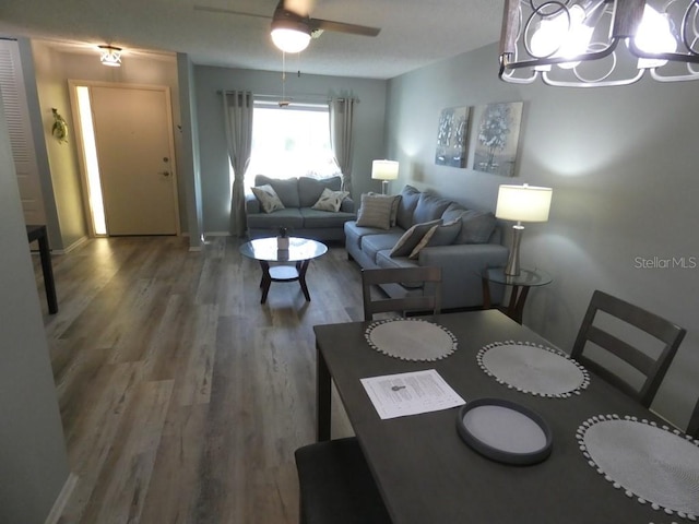 dining room with hardwood / wood-style floors and ceiling fan