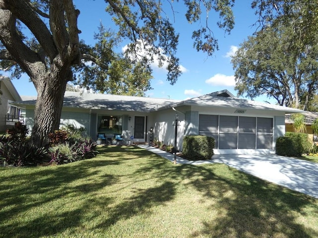 ranch-style home with a front yard and a garage