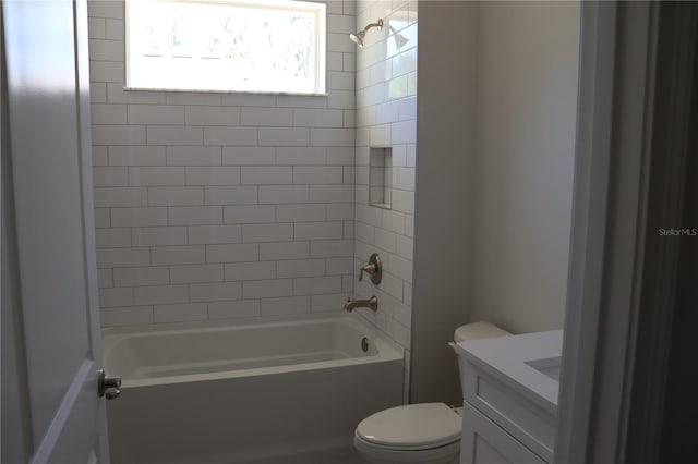 bathroom with toilet, vanity, and shower / bathing tub combination