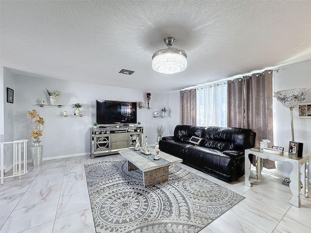 living room featuring a textured ceiling