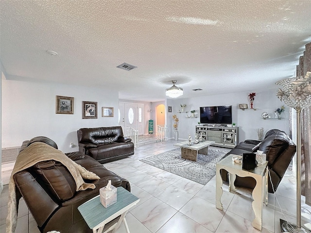 living room with a textured ceiling