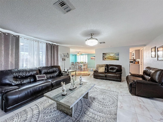 living room with a textured ceiling