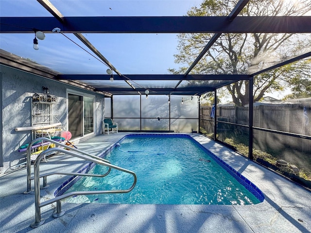 view of pool featuring a patio area and a lanai