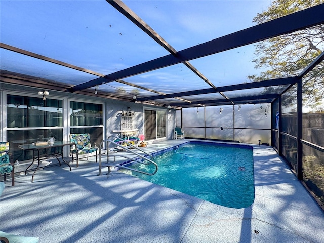 view of swimming pool featuring a patio and glass enclosure