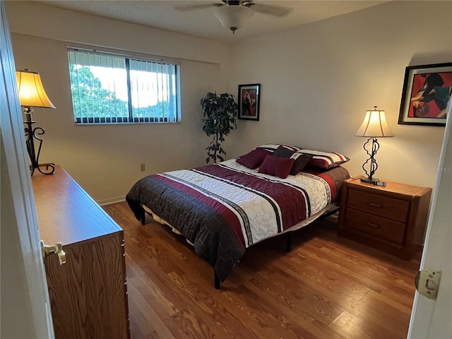 bedroom with hardwood / wood-style flooring and ceiling fan