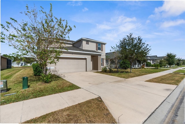 view of front facade with a front yard and a garage