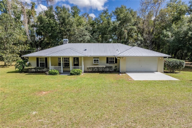 single story home with a front lawn, a garage, and covered porch