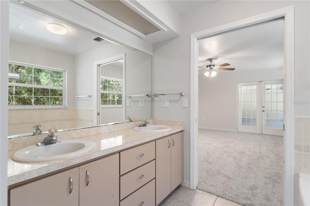 bathroom featuring french doors, tile patterned flooring, vanity, and ceiling fan