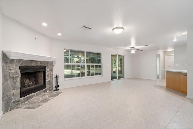 living room with a fireplace and ceiling fan