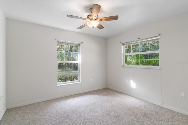 carpeted empty room with ceiling fan