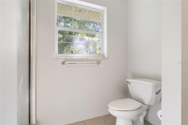 bathroom featuring toilet and tile patterned floors