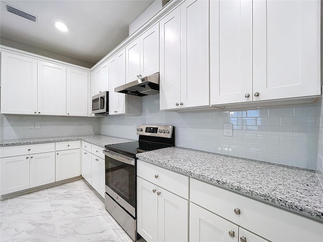 kitchen with stainless steel appliances, white cabinetry, and under cabinet range hood