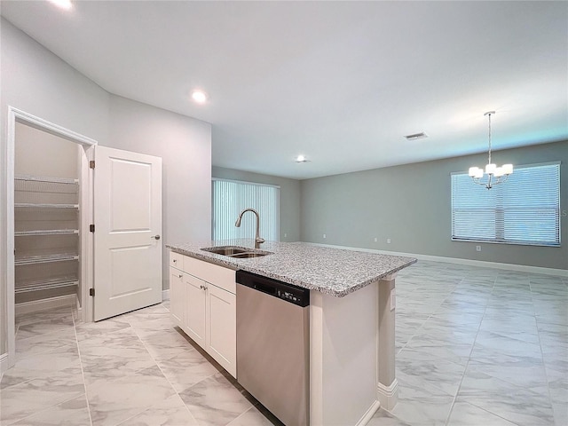 kitchen with a sink, marble finish floor, a kitchen island with sink, and dishwasher