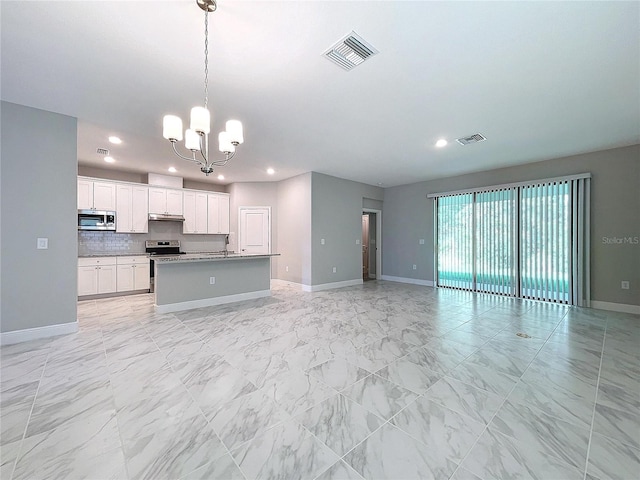 kitchen with pendant lighting, stainless steel appliances, visible vents, open floor plan, and white cabinetry