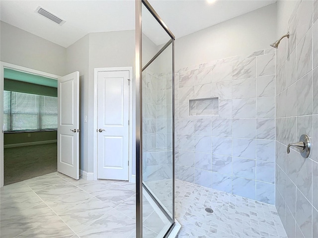 bathroom featuring a shower stall and visible vents