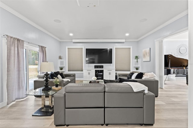 living room with light hardwood / wood-style flooring and crown molding